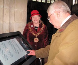 colour photograph of Mayor and touchscreen
