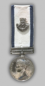 An image of the obverse of the Royal Naval General Service Medal with Copenhagen Clasp. The medal shows a left-facing effigy of Queen Victoria, with the inscription "VICTORIA REGINA" and the date “1848”. A 95th cap badge has been added.